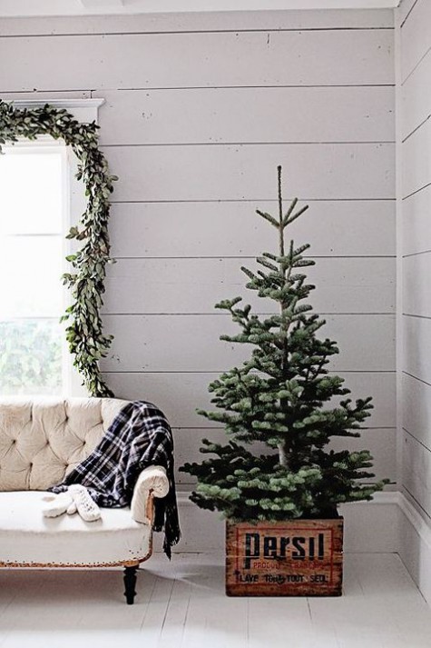 place a tree in a crate and don\'t use any decor, keep it simple