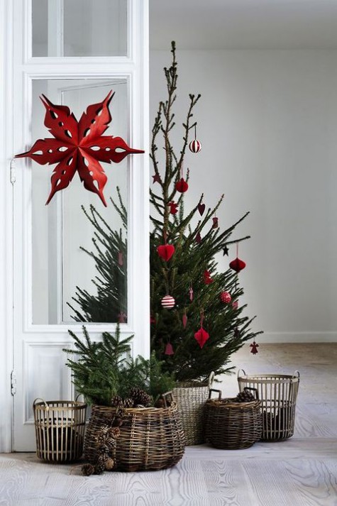 red ornaments, red paper ornaments, a tree in a basket