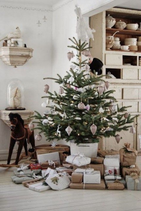 small tree in a white bucket, metallic ornaments
