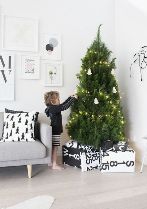 small tree with lights and clay ornaments