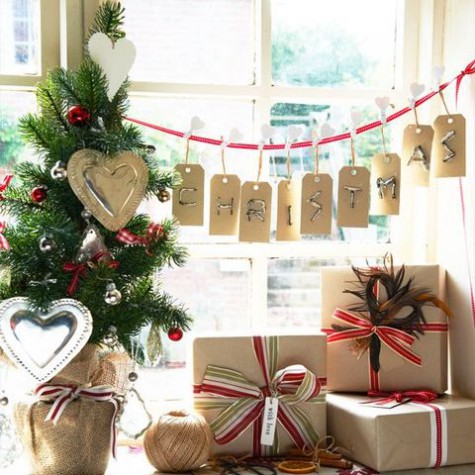 small tree with ornaments and paper hearts