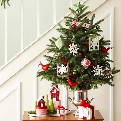 tabletop tree with paper ornaments in a silver bucket