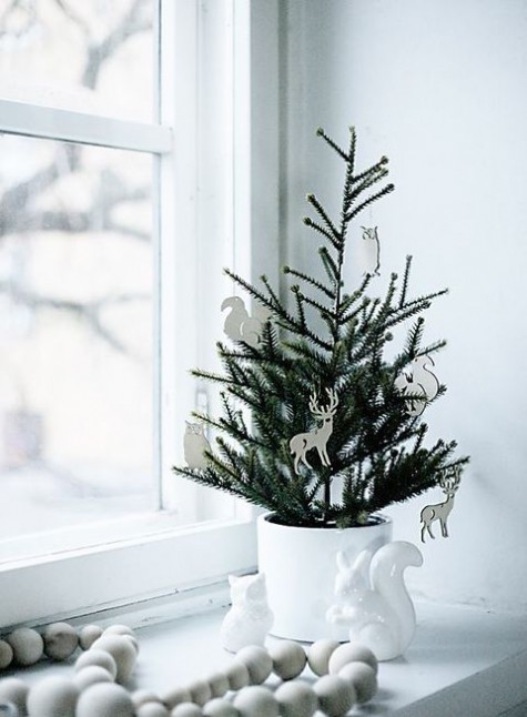 tiny potted tree with cardboard ornaments