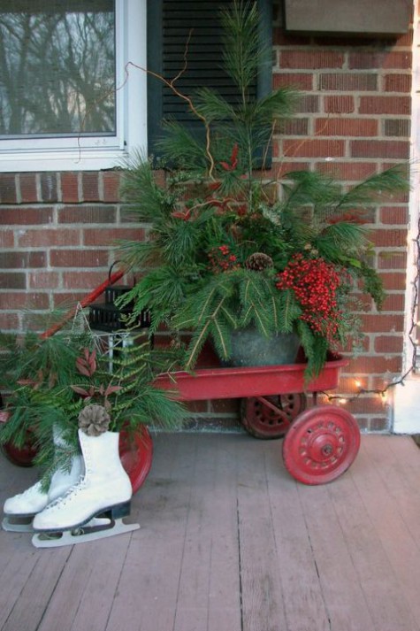 a red trolley, evergreens and berries, pinecones