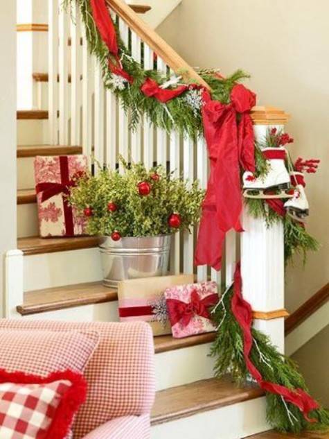 evergreens and leaves, red garlands and ornaments