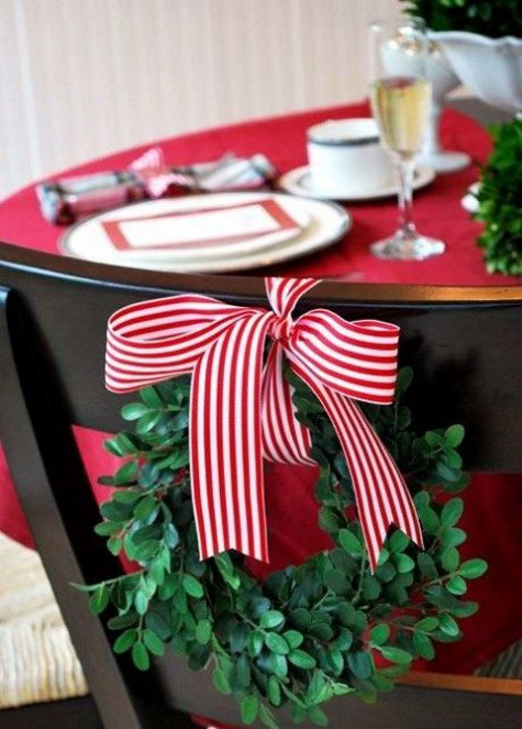 foliage wreath with red and white ribbon