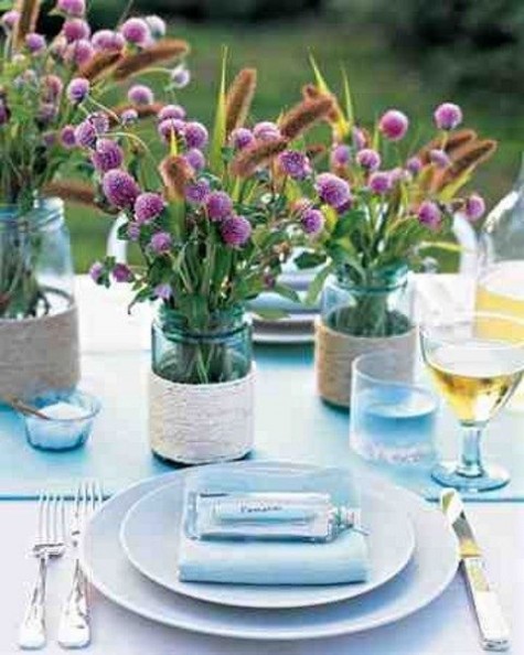 blue napkins and glasses, wildflowers in twine wrapped jars