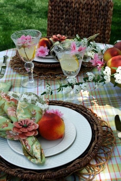 checked tablecloth, wicker chargers and floral print napkins