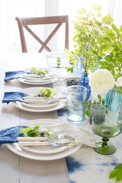 indigo shibori table runner and napkins, blue and green vases and glasses
