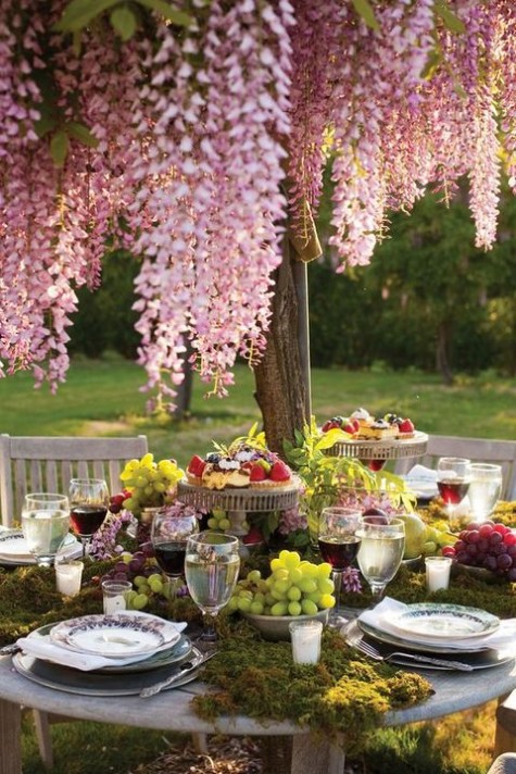 lush moss tablescape with grapes and greenery for decor