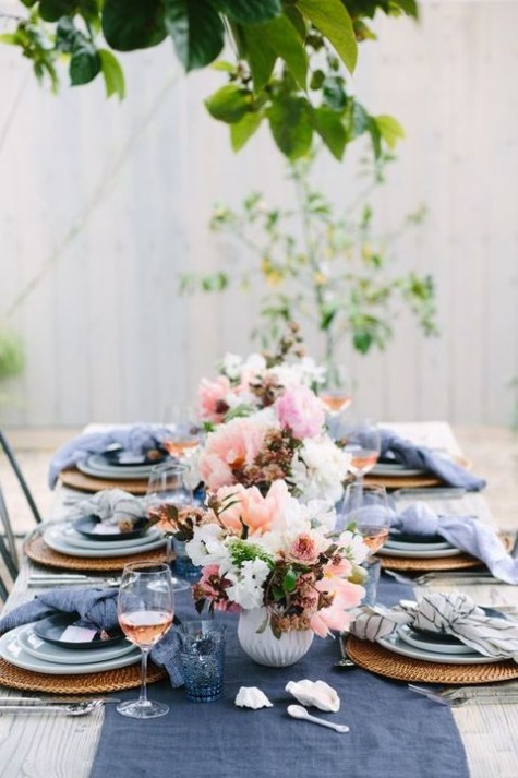 muted blue table runner and napkins, peachy, pink and white florals and blue glasses