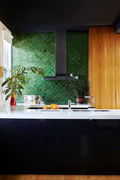 add a colorful accent to your monochromatic kitchen with a green fishscale tile backsplash