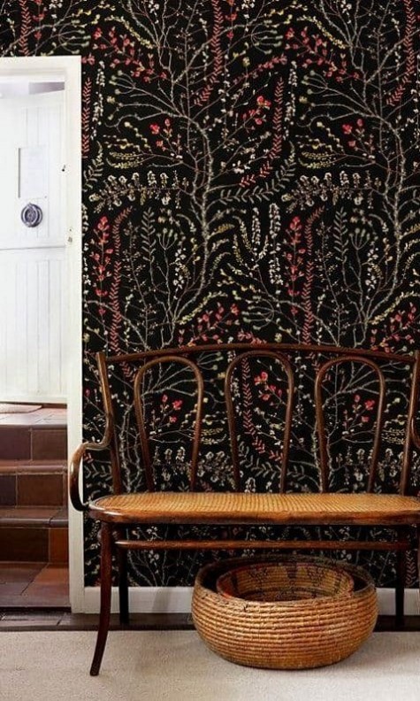 black wallpaper with a botanical print for an entryway