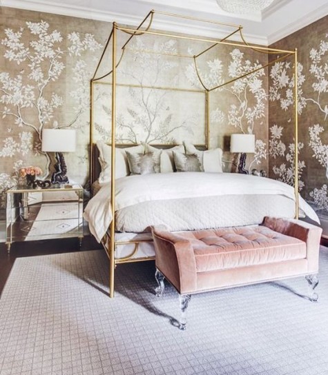 mirror nightstands, chic floral wallpaper, a refined brass bed frame and a pink velvet ottoman