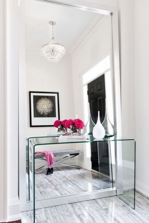 a cler acrylic console for a modern entryway