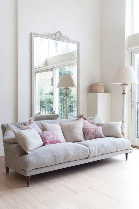 a large shabby chic mirror in the pastel and soft living room