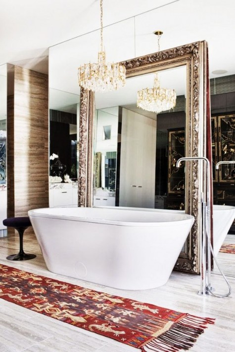 a mirror wall and an orante mirror integrated into it