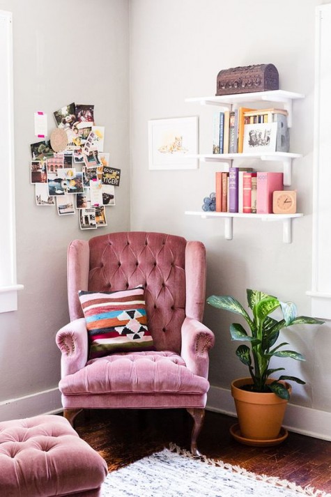 a pink velvet chair with a footrest for a refined feel