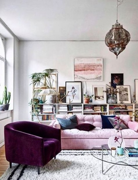 a purple velvet chair makes a statement in this girlish space