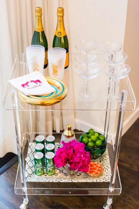 a sheer bar cart is cool for receiving guests