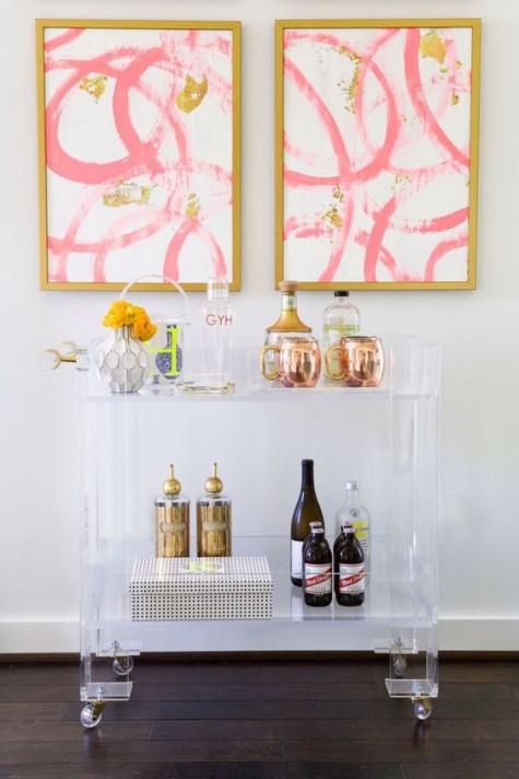an acrylic bar cart on casters is a chic modern idea
