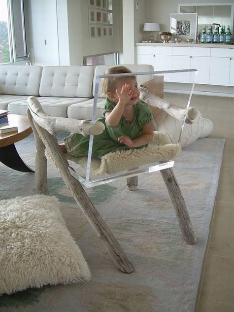 an acrylic chair with driftwood armrests and legs