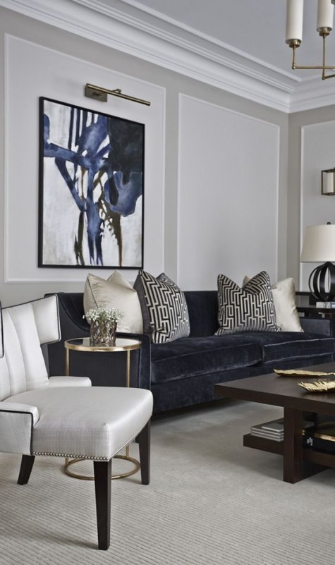 an elegant modern space with a very dark navy-grey sofa