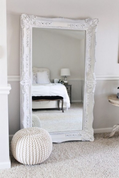 an ornate floor mirror in the bedroom will add a chic vintage feel