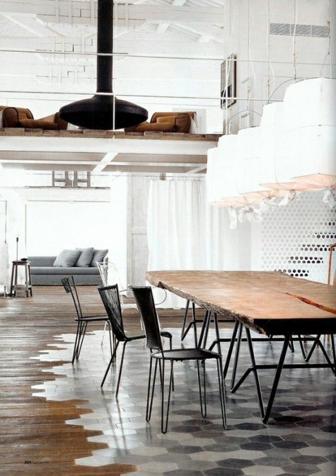 marble hexagon tiles under the dining space and wooden floors around