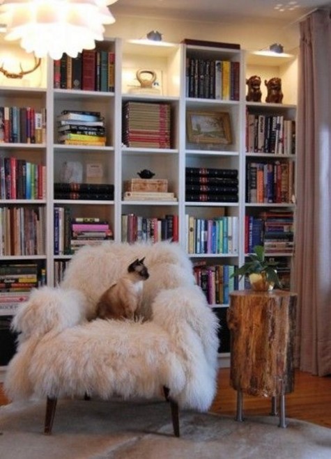 a cozy reading nook with a faux fur chair for coziness