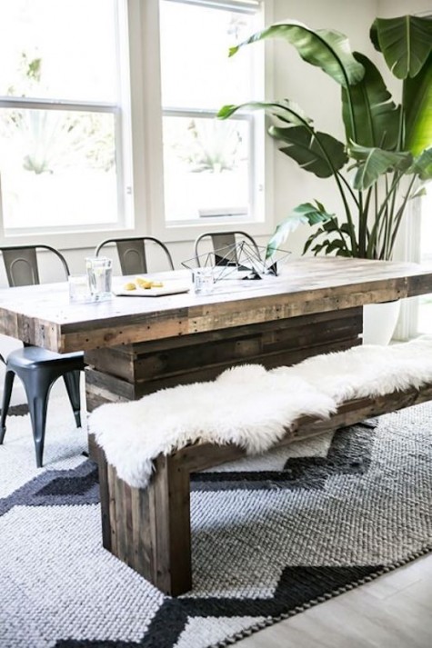 a dining set of reclaimed wood with a bench covered with faux fur
