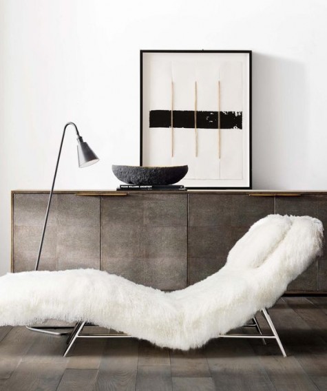 a lounger covered with white faux fur looks very inviting