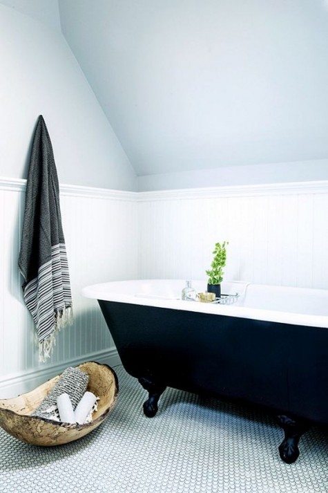 a neutral bathroom got more texture with marble penny tiles on the floor