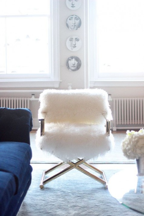 a usual chair covered with white faux fur looks luxurious