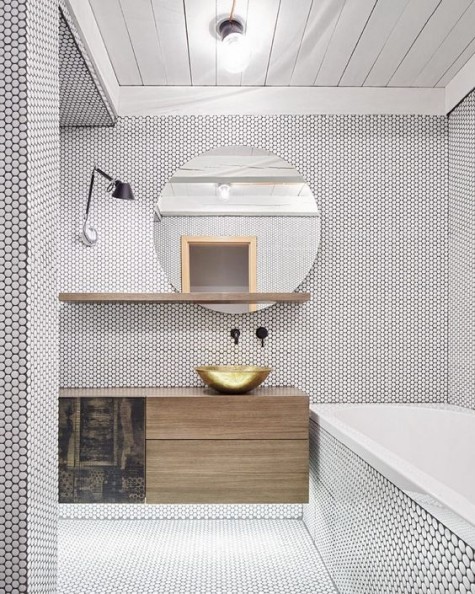 white penny tiles with black grout for creating a textural look