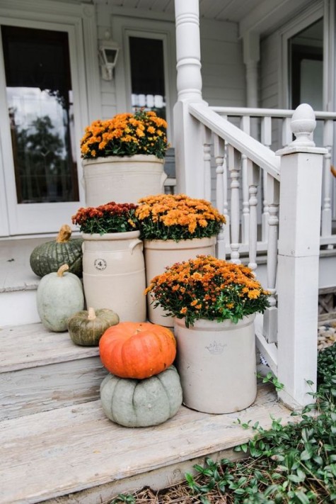 place some pots with fall blooms and natural pumpkins on the steps to make them cool