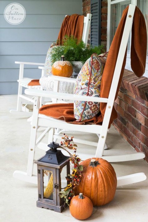 rockers_ a lantern with corn_ pumpkins and fall orange blankets