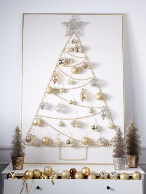 a Christmas tree sign of pearly and silver ornaments and a pearl garland