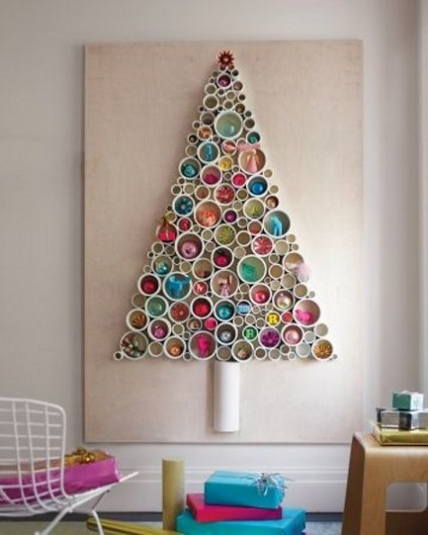 a PVC pipe Christmas tree with various ornaments inside