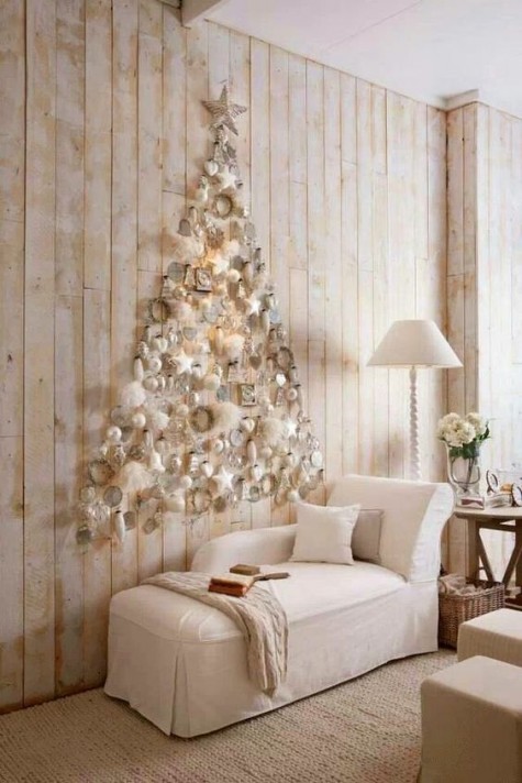 a creamy wall-mount Christmas tree with ornaments