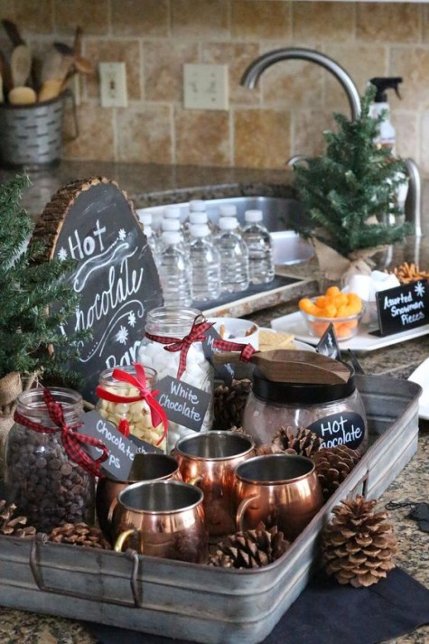 a hot chocolate bar with jars_ pinecones_ copper mugs and a chalkboard wood slice