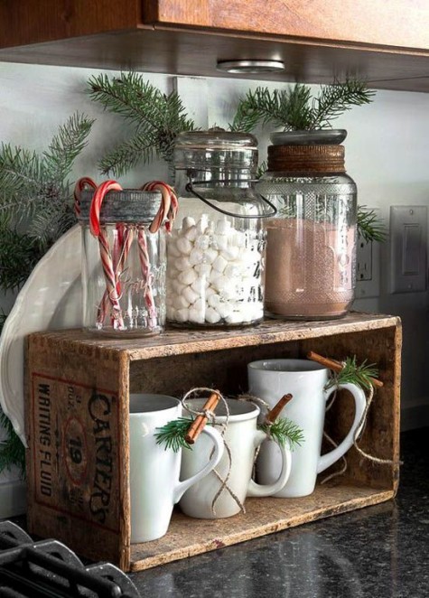 a hot chocolate station with a crate and yummies in jars