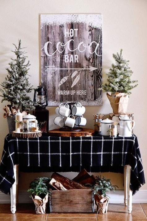 a rustic hot chocolate bar with fir trees_ candles wood slices
