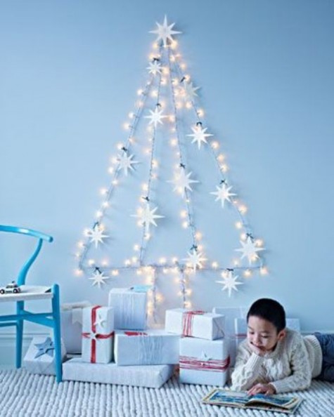 a star light garland forming a wall-mount Christmas tree