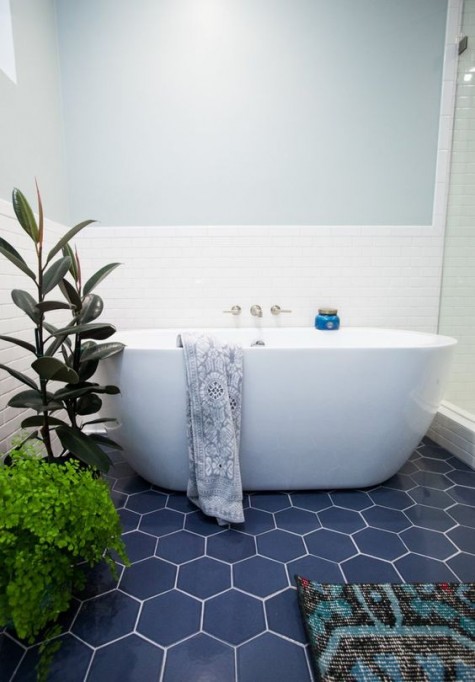 navy hex tiles with white grout and white walls for a contrasting look