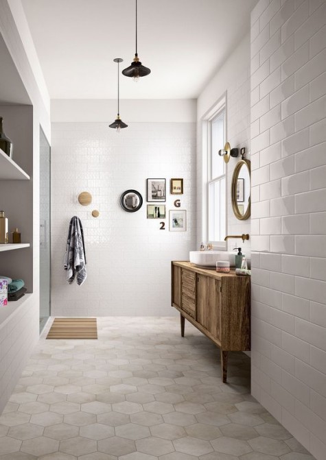 neutral hex tiles on the floor and more usual ones on the walls