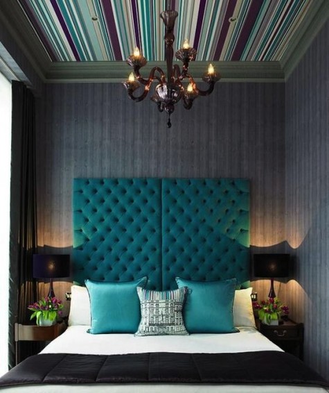 a bold and tall turquoise tufted headboard of two parts