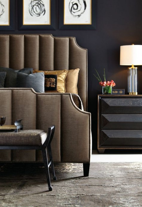 a brown velvet headboard with antique brass nailhead outlines