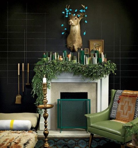 a lush evergreen garland, lots of green, gold and white candles