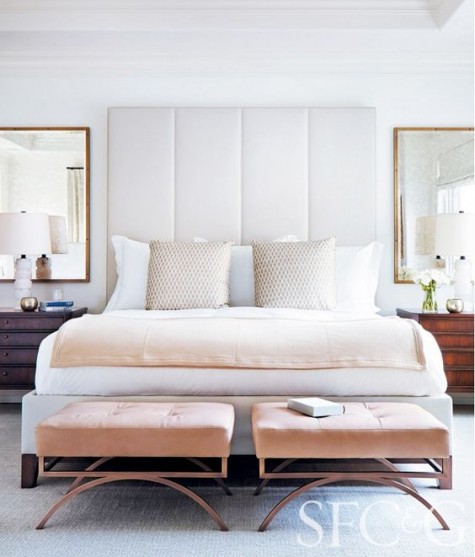 a modern upholstered headboard in cream makes a statement